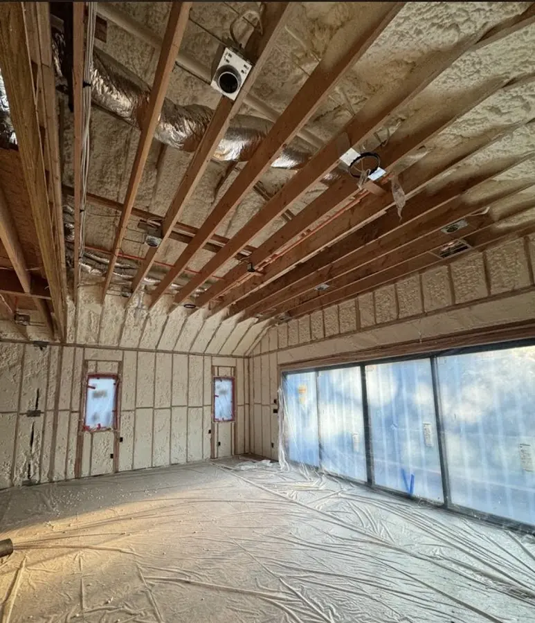 Interior walls and ceiling insulated with spray foam during new construction in Hillsdale